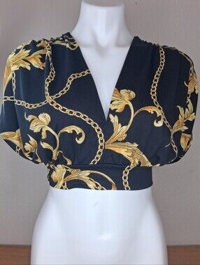 Beautiful black and gold cropped blouse featuring an elegant baroque-inspired pr